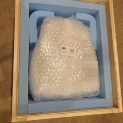 Item bubble wrapped and secured in shock-absorbent foam