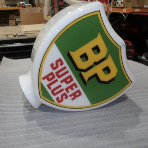 A fragile glass petrol pump globe awaiting packing